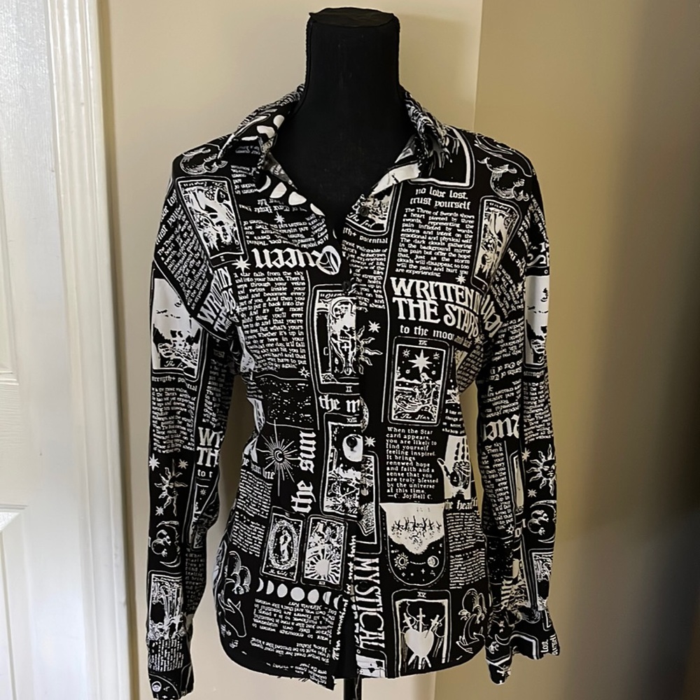 Black and white button down breaking news shirt. This shirt is very comfortable.